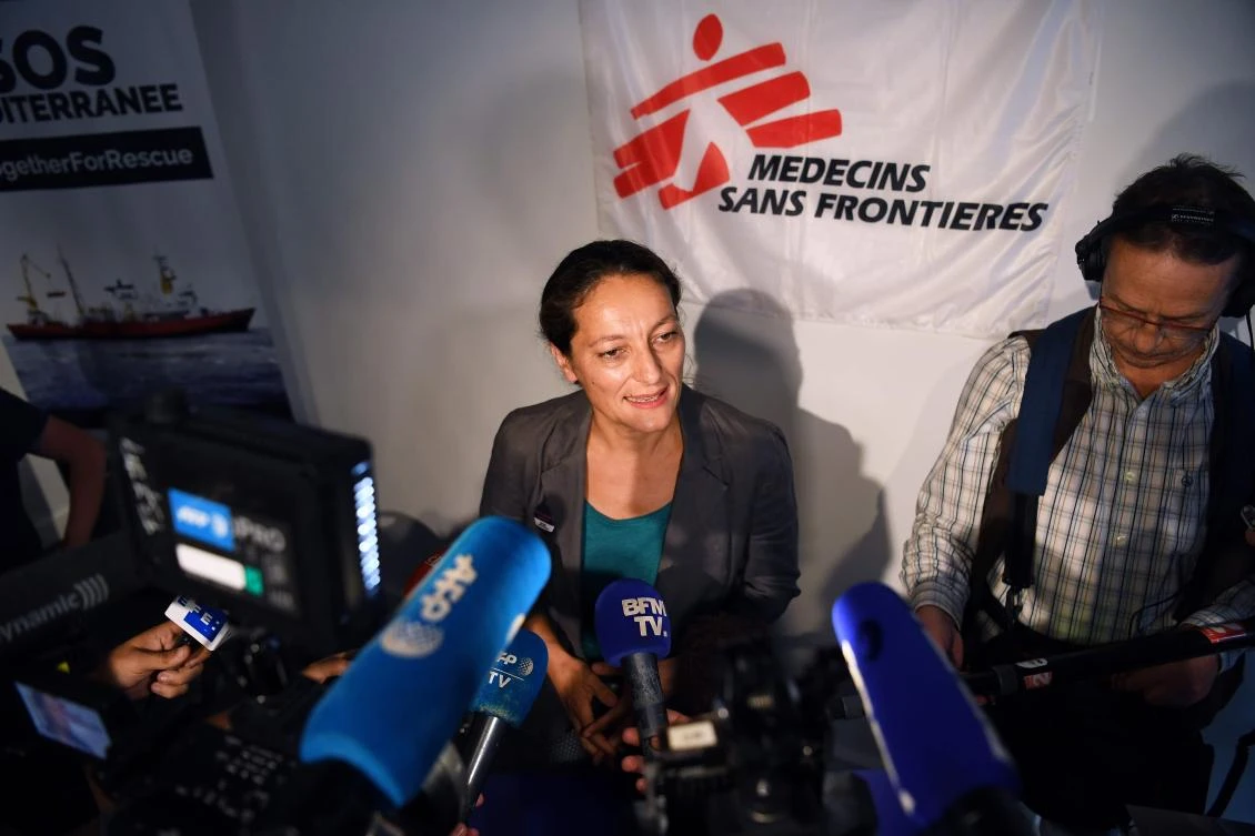 French aid group SOS Mediterranee managing director Sophie Beau speaks during a joint press conference by SOS Mediterranee and international medical NGO Doctors Without Borders (MSF) over the migrant rescue ship Aquarius, chartered by the two groups, on August 14, 2018, in Paris European countries faced pressure on August to resolve a fresh standoff with the operators of the migrant rescue ship Aquarius which is stranded for the second time in the Mediterranean carrying 141 people. (AFP)