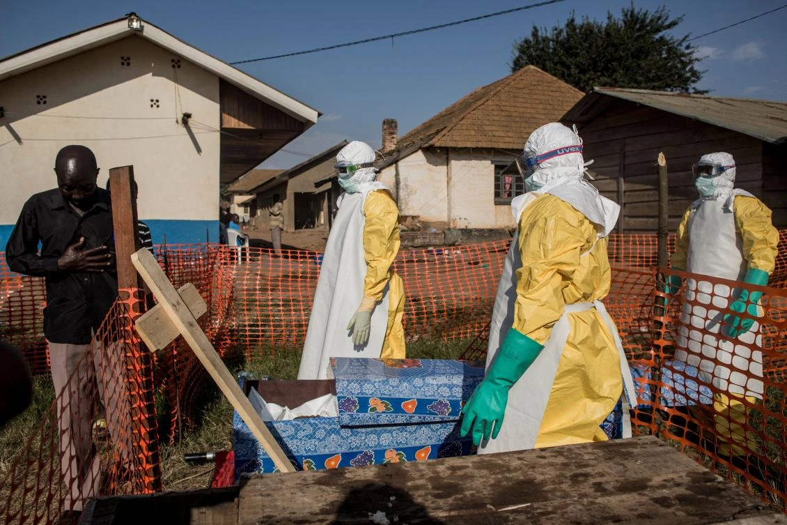 A family member of a deceased, unconfirmed Ebola patient, reacts inside an Ebola Treatment Centre run by The Alliance for International Medical Action (ALIMA) on August 13, 2018, in Beni. (AFP)