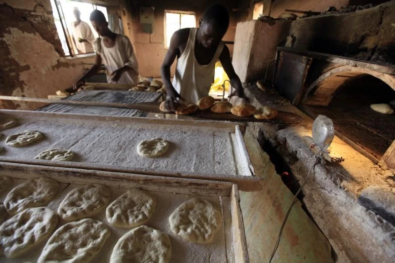 A baker prepares bread in Khartoum. The capital city and other parts of Sudan have been hit by shortages of the basic staple. (Reuters)