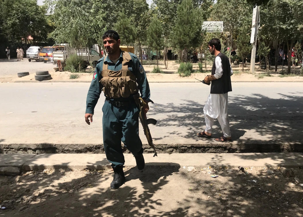Staff and officials at the center took shelter in a protected area of the compound as gunfire came from a half-finished building near the site. (Reuters)