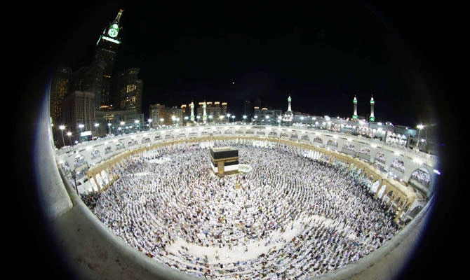 Muslim worshippers perform prayers around the Kaaba, Islam's holiest shrine, at the Grand Mosque in Saudi Arabia's holy city of Makkah on August 15, 2018, prior to the start of the annual Hajj pilgrimage in the holy city. (AFP)