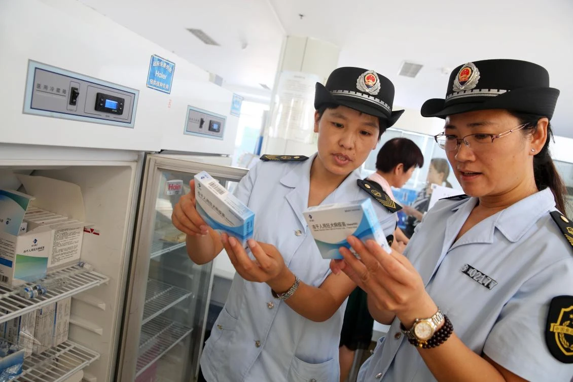 Food and Drug Administration officials check rabies vaccines at the Disease Control and Prevention Center in Huaibei in the aftermath of a vaccine scandal that inflamed public fears over the safety of domestically produced drugs. (AFP)