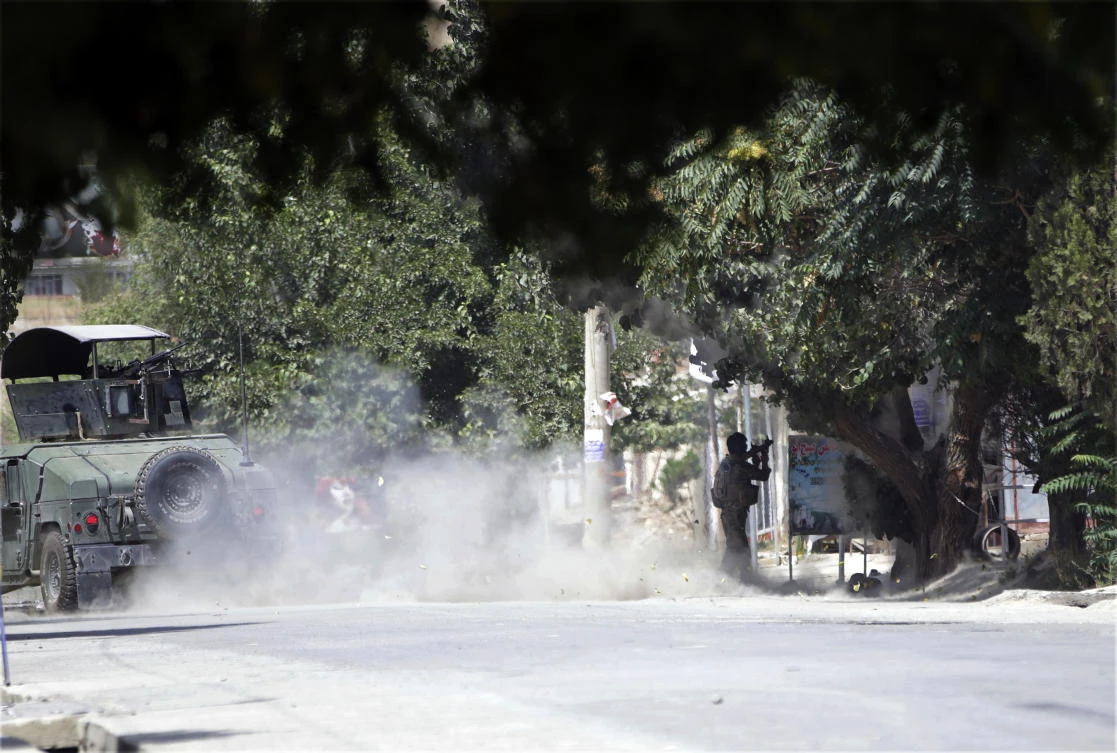 A special forces soldier fires his weapon during a clash between insurgents and security forces in Kabul on Thursday, August 16. (AP)
