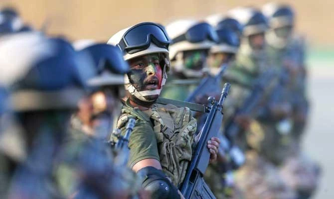 Saudi armed forces march during a parade in Saudi Arabia's holy city of Makkah on August 13, 2018, ahead of the annual Hajj pilgrimage. (AFP)