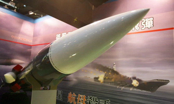 In this Aug. 10, 2011, file photo, Taiwan's indigenous Hsiung Feng III missile is propped against the backdrop of a billboard depicting a missile-riddled aircraft carrier, closely resembling China's carrier "Varyag," during a media preview of the Taipei Aerospace and Defense Technology show in Taipei, Taiwan. (AP)