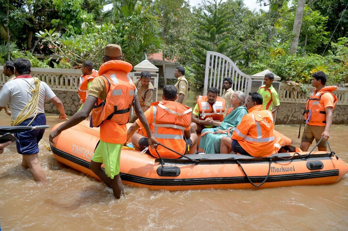 Rescuers waded into submerged villages in southern India on Aug. 19 in a desperate search for survivors cut off for days by floods that have already killed more than 350 people. (AFP/Manjunath Kiran)