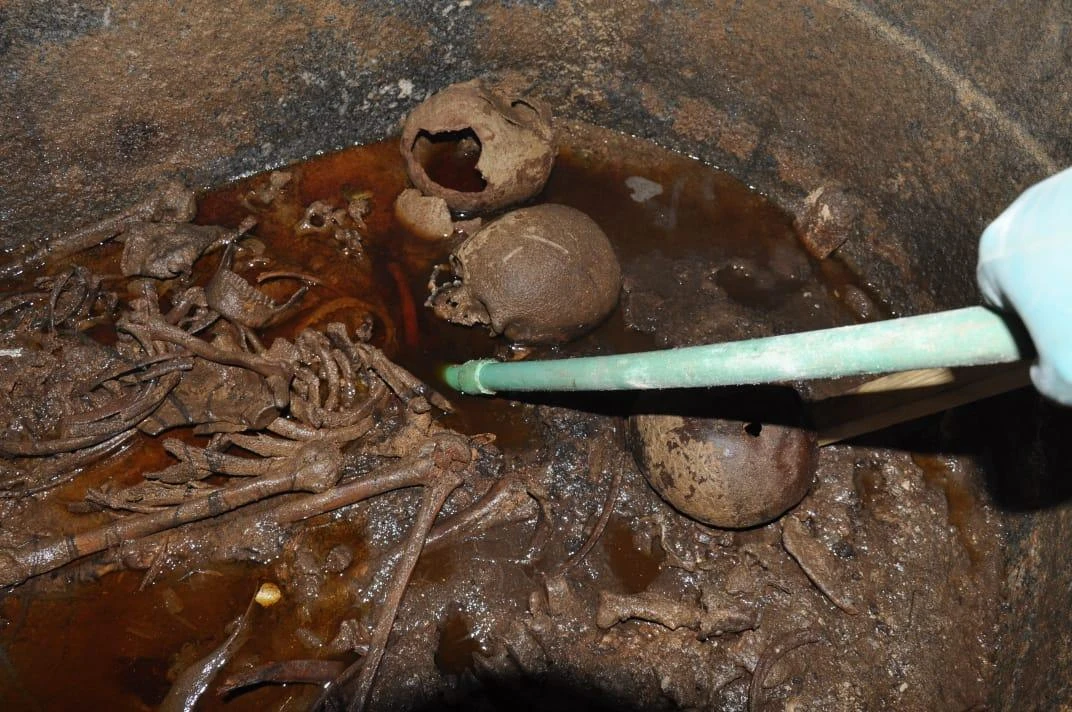 The skeletons in the black granite sarcophagus uncovered in July in the Sidi Gaber district of Alexandria. (Egyptian Antiquities Ministry/AFP)