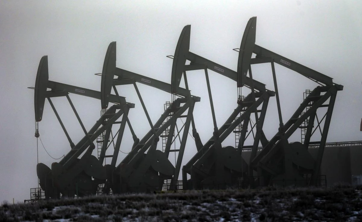 In this Dec. 19, 2014, file photo, oil pump jacks work in unison in Williston, N.D. Conserving oil is no longer an economic imperative for the U.S., the Trump administration declares in a major new policy statement that threatens to undermine decades of government campaigns for gas-thrifty cars and other conservation programs. (AP)