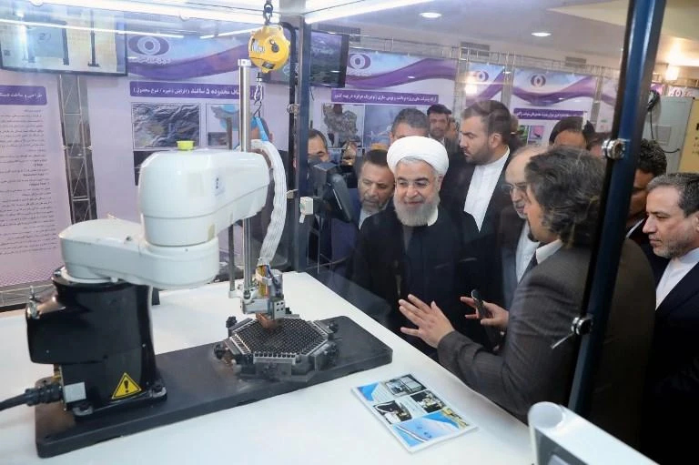 Iranian President Hassan Rouhani, center, during a ceremony to mark National Nuclear Technology Day in Tehran on April 9. (Iranian Presidency / AFP)