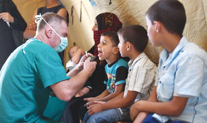Russian medics have been helping Syrian refugees at the Abu Duhur crossing on the eastern edge of Idlib province. (AFP)
