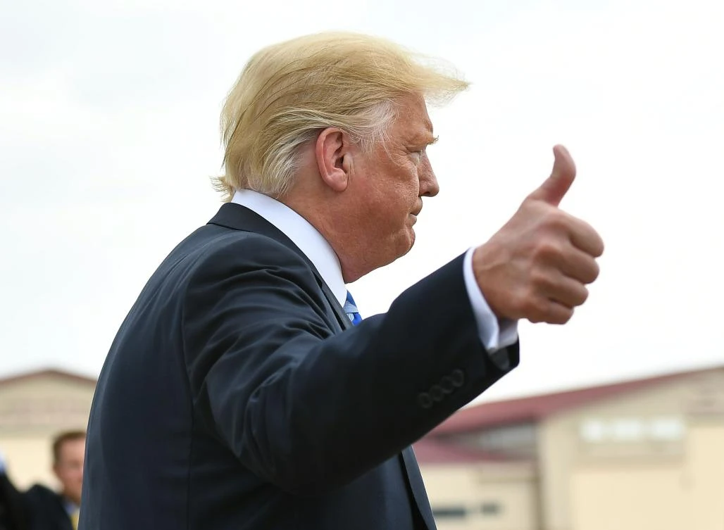 US President Donald Trump speaks to the press upon arrival at Yeager Airport in Charleston, West Virginia on August 21, 2018. (AFP)