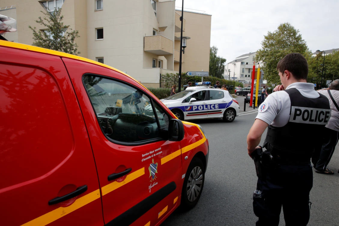 French police secure a street after a man killed two persons and injured an other in a knife attack in Trappes, near Paris. (Reuters)