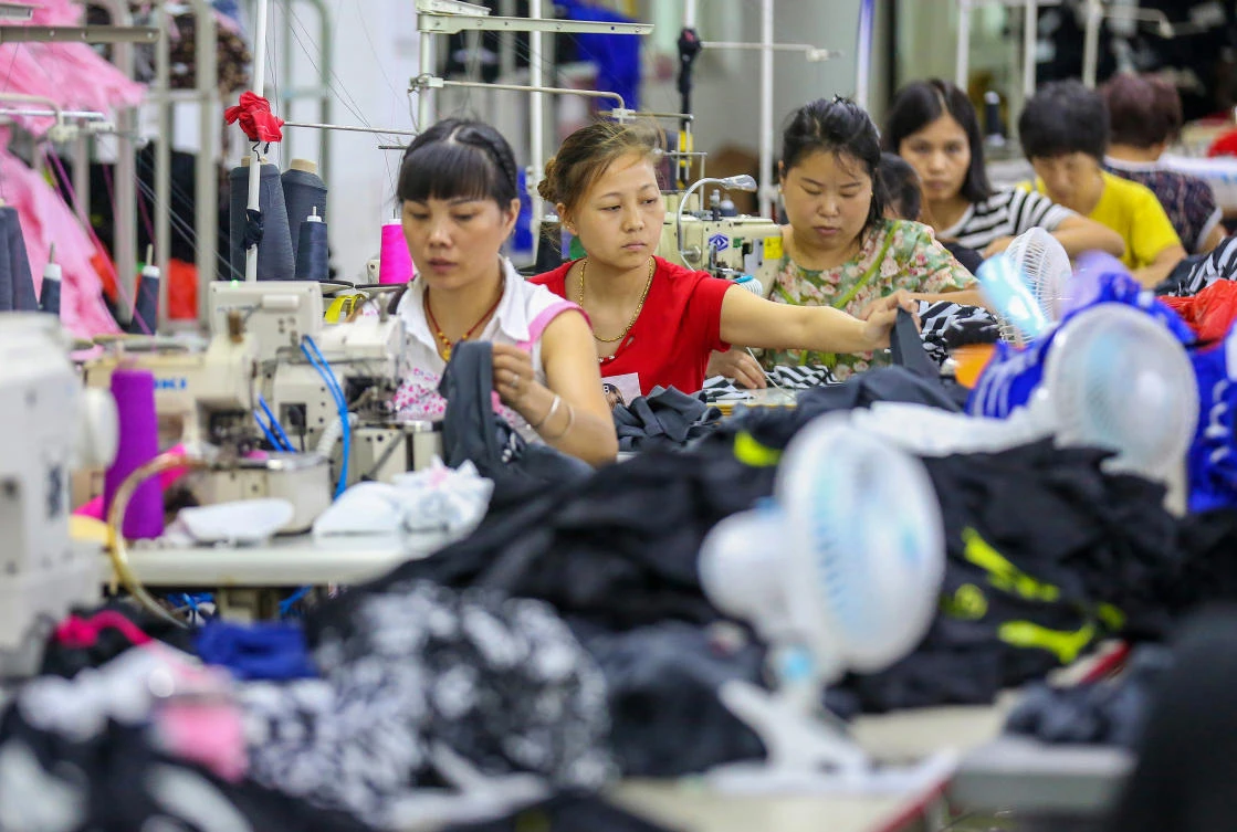 Workers at a swimwear factory in Yinglin town in Jinjiang, in China's eastern Fujian Province. China's top envoy, Foreign Minister Wang Yi, called on the United States to remain "cool-headed." (AFP)