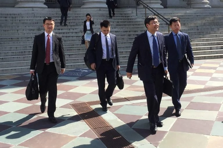 Members of the Chinese trade delegation leave the US Treasury building after two days of talks with US representatives in Washington DC on Thursday, August 23. (AFP)