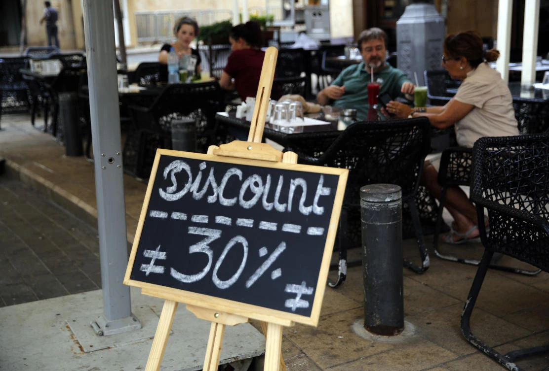 A restaurant offers a 30 percent discount in downtown Beirut. (AP)