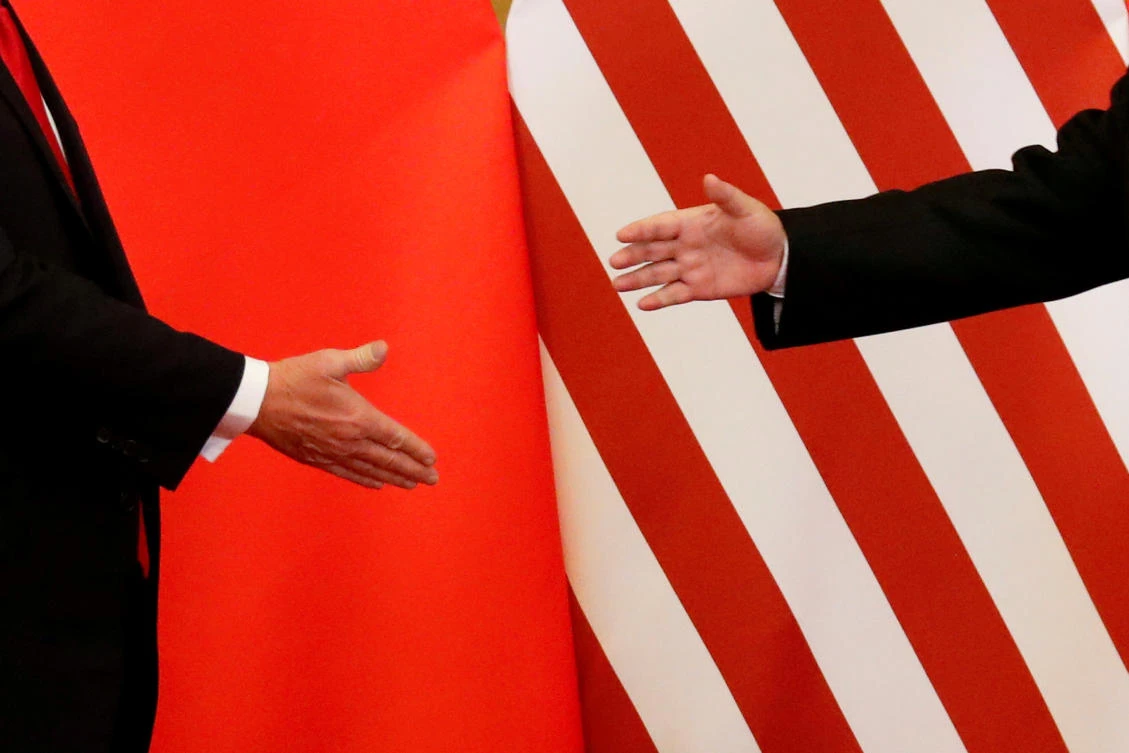 US President Donald Trump and China’s President Xi Jinping shake hands after making joint statements at the Great Hall of the People in Beijing, China. (File photo: Reuters)