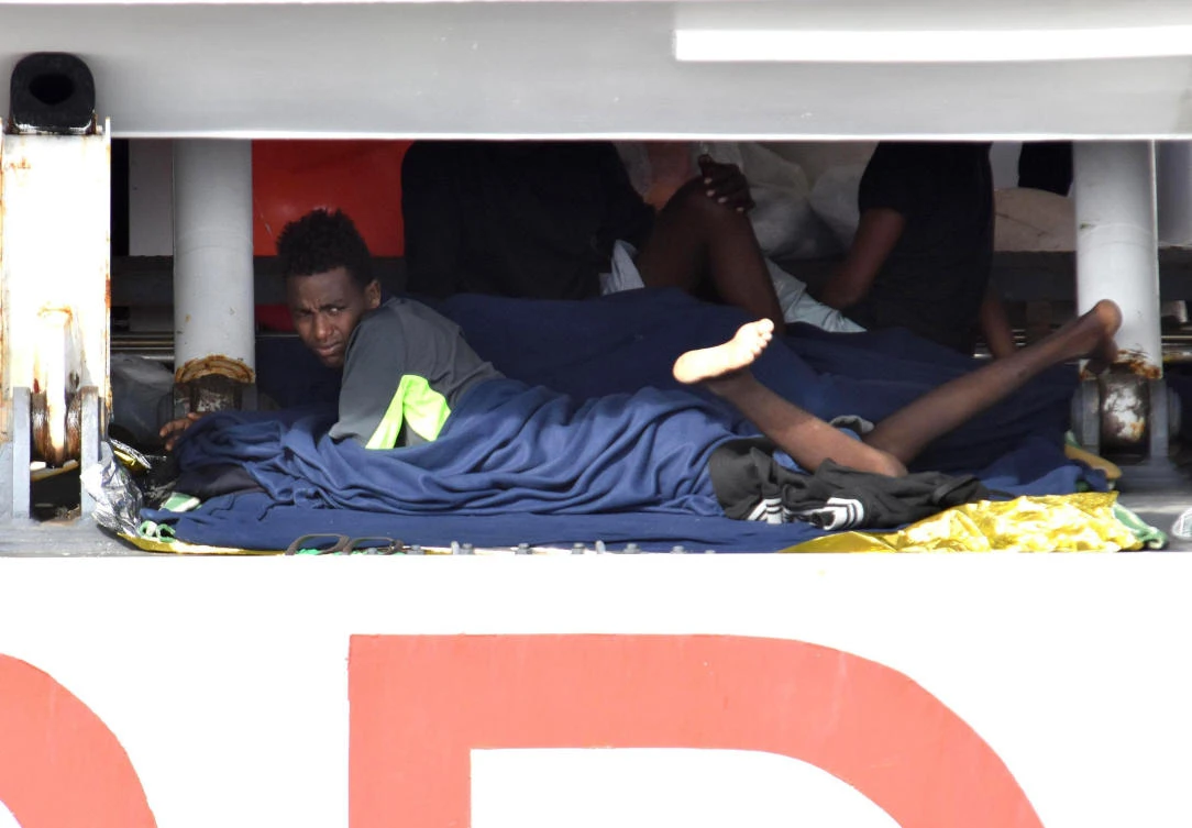 Migrants wait to disembark from Italian Coast Guard ship Diciotti in the port of Catania, Italy, Thursday, Aug. 23, 2018. (AP)