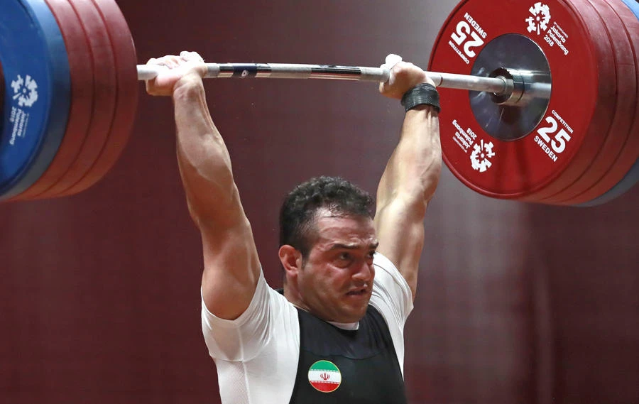 Iran's Sohrab Moradi competes during the men's 94kg weightlifting at the Asian Games in Jakarta, Indonesia, on Aug. 25, 2018. (AP Photo/Tatan Syuflana)