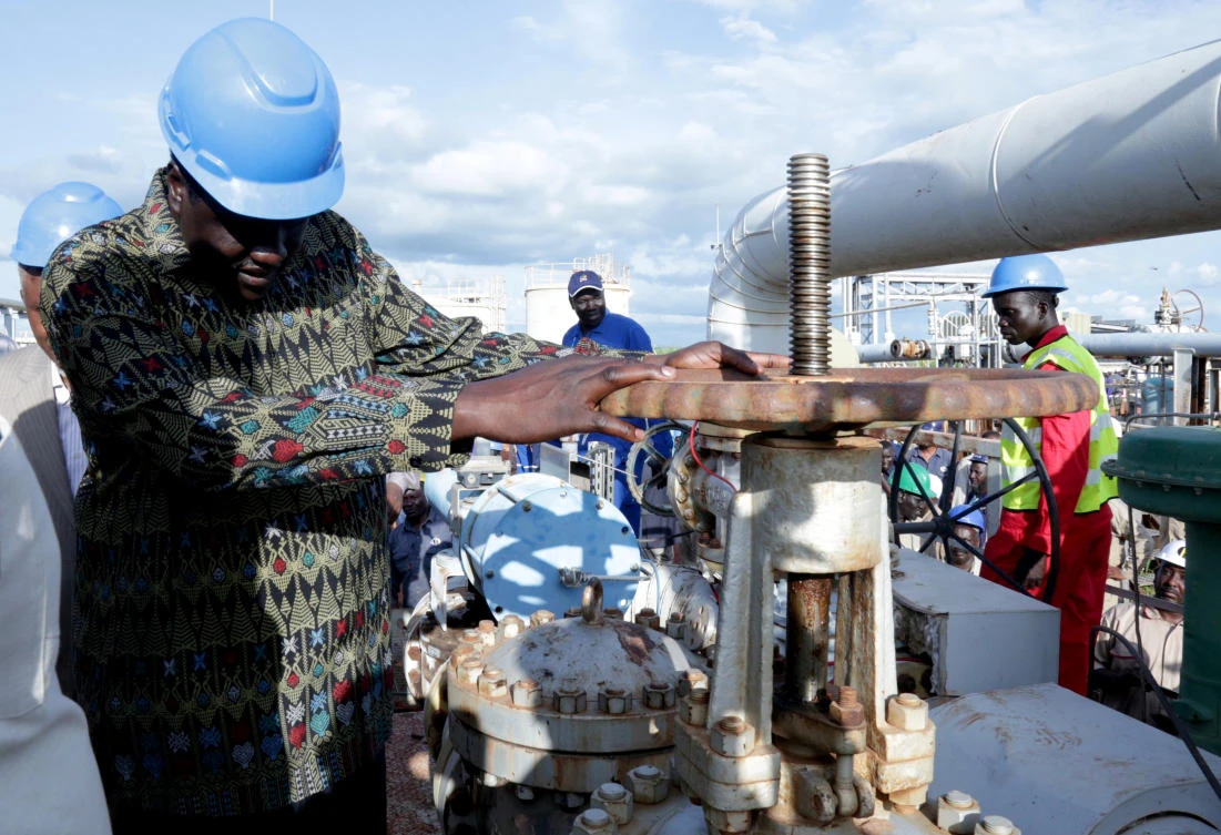 South Sudan’s Minister of Petroleum, Ezekiel Lol Gatkuoth, turns a spigot at an oil well at the Toma South oil field to Heglig, in Ruweng State, South Sudan August 25, 2018. (Reuters)