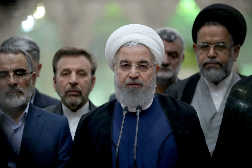 This handout picture released by the Iranian presidency on August 25, 2018, shows Iranian President Hassan Rouhani delivering a speech at the shrine of the revolutionary leader Khomeini in southern Tehran. (AFP)