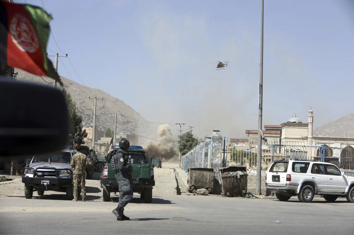 In this Tuesday, Aug. 21, 2018 file photo, nn MD 530F military helicopter targets a house where attackers are hiding in Kabul, Afghanistan. (AP)