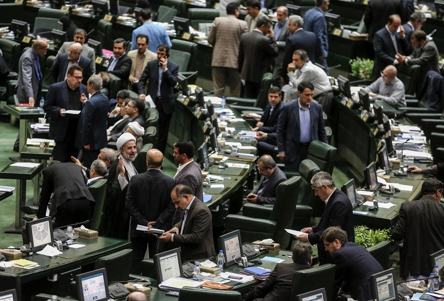 Pressures mounted on Iranian President Hassan Rouhani on Tuesday as lawmakers summoned him to answer questions on weak economic growth and rising prices. (File photo: AFP)