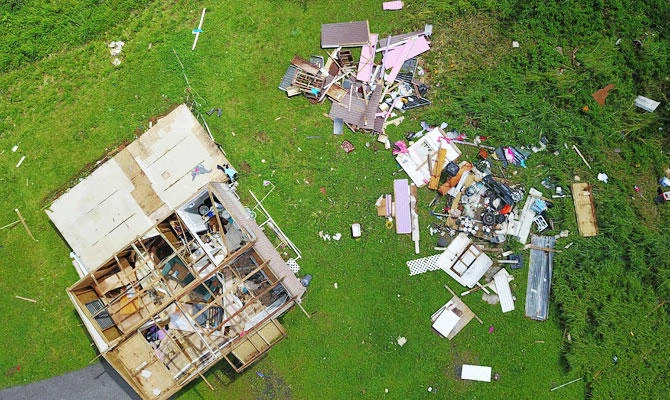 In this file photo taken on September 24, 2017 a house destroyed by hurricane winds is seen in Barranquitas, southwest of San Juan, Puerto Rico, following the passage of Hurricane Maria. (AFP)