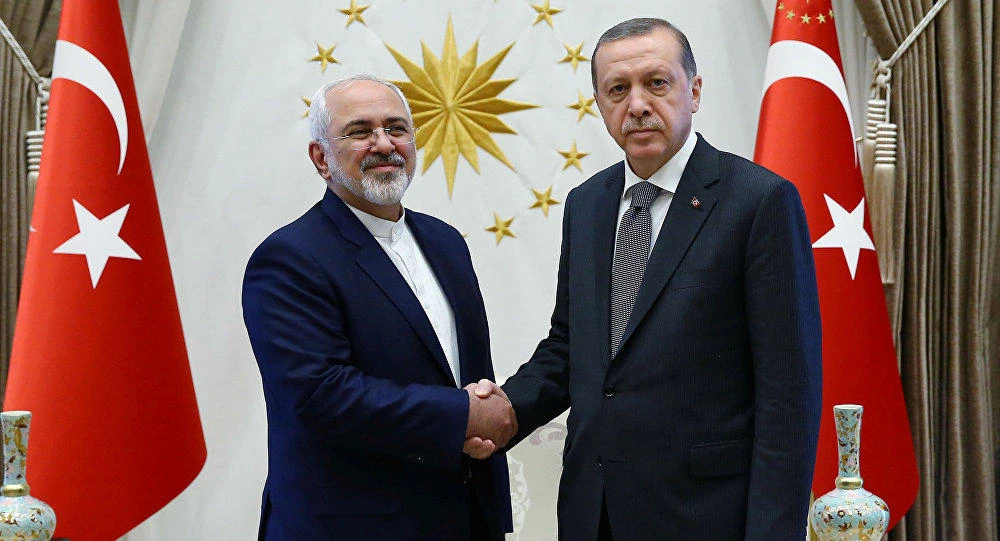 File photo shows Turkey's President Tayyip Erdogan shaking hands with Iranian Foreign Minister Mohammad Javad Zarif. (Reuters)