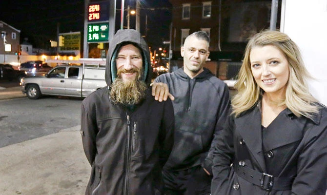This Nov. 17, 2017, file photo, Johnny Bobbitt Jr., left, Kate McClure, right, and McClure's boyfriend Mark D'Amico pose at a Citgo station in Philadelphia. (AP)