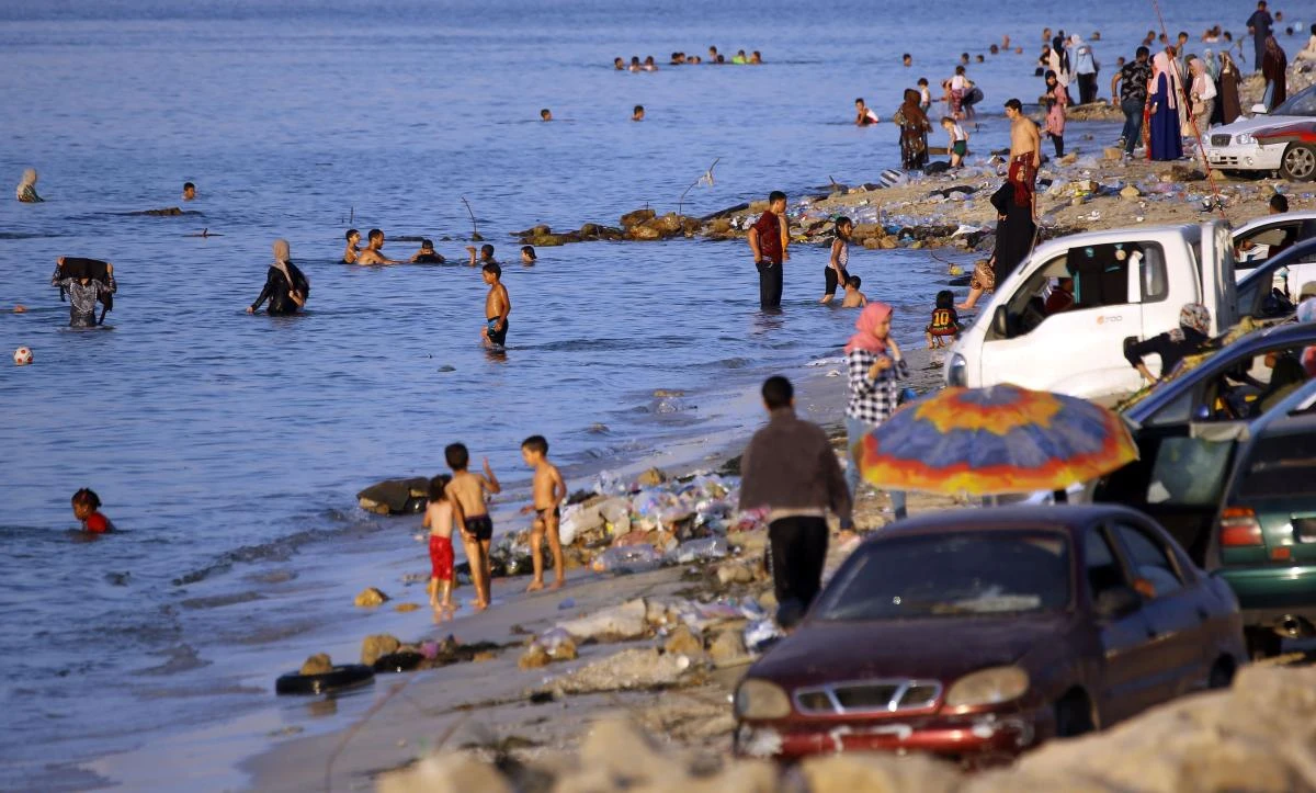 Tripoli residents flock to beaches and other public spaces during frequent power outages, escaping the heat of their homes as whirling fans and air conditioning remain switched off. (AFP)