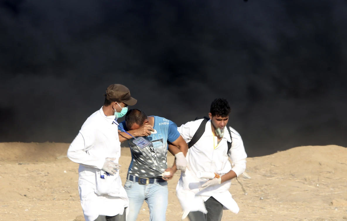 The Gaza health ministry says Israeli gunfire wounded 50 Palestinians protesting along the border with Israel, and scores were treated for tear gas inhalation. (AP)