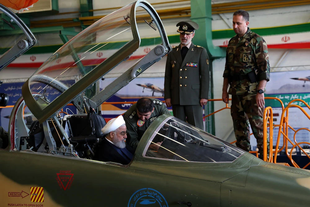 President Hassan Rouhani (L) sitting in the cockpit of the ‘Kowsar’ domestic fighter jet, at the National Defense Industry exhibition in the capital Tehran. (AFP)