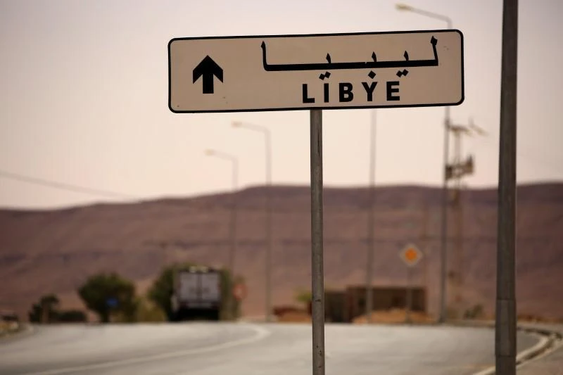 A road sign shows the direction of Libya near the border crossing at Dhiba, Tunisia April 11, 2016. (Reuters)