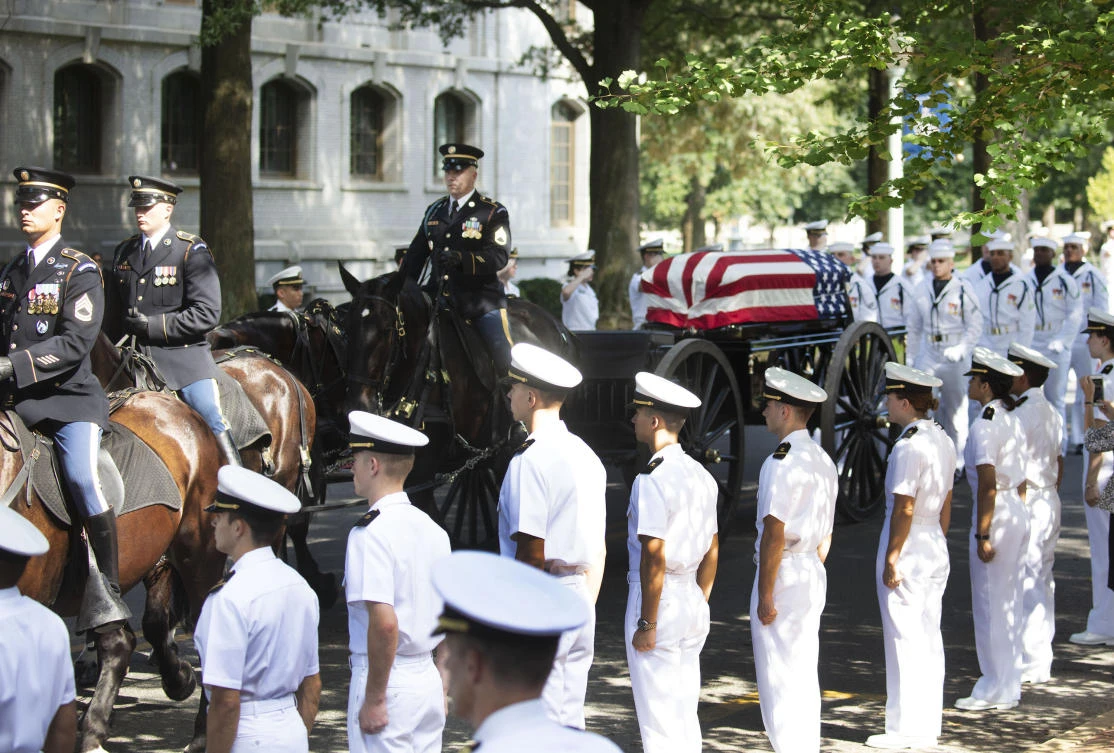 War hero McCain buried at Naval Academy alongside a longtime friend