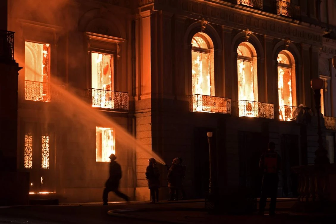 Firefighters work as a massive fire engulfs the National Museum in Rio de Janeiro, one of Brazil’s oldest, on Sept. 2, 2018. The cause of the fire was not yet known, according to local media. (AFP / Carl De Souza)