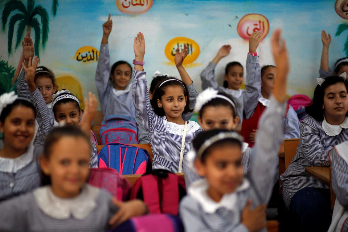 Palestinian schoolgirls attend a lesson inside a classroom at a school run by the United Nations Relief and Works Agency (UNRWA), at Al-Shati refugee camp in Gaza City September 3, 2018. (Reuters)