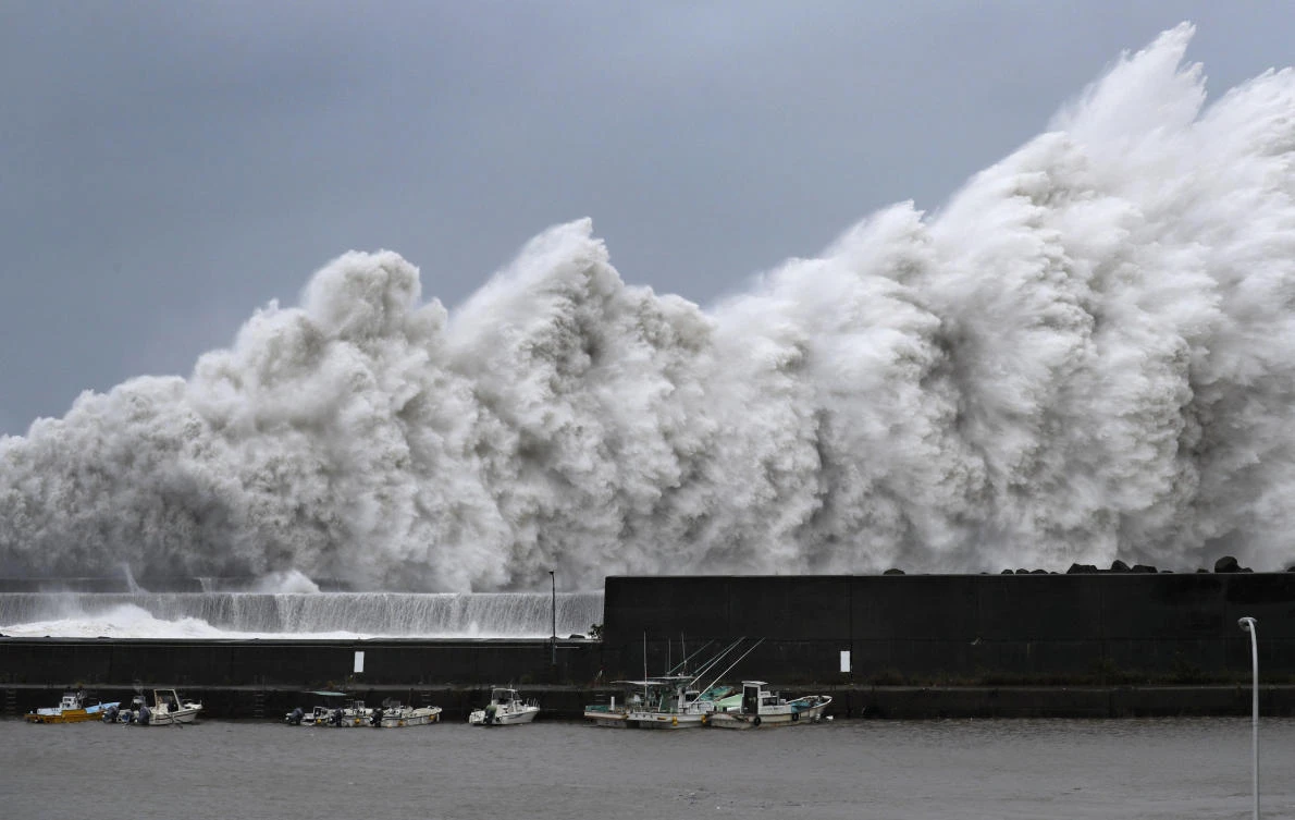 Japan’s weather agency has issued warnings about possible landslides, flooding and violent winds, as well as high tides, lightning and tornadoes in a swath of western Japan including the major cities of Osaka and Kyoto. (Kyodo News via AP)