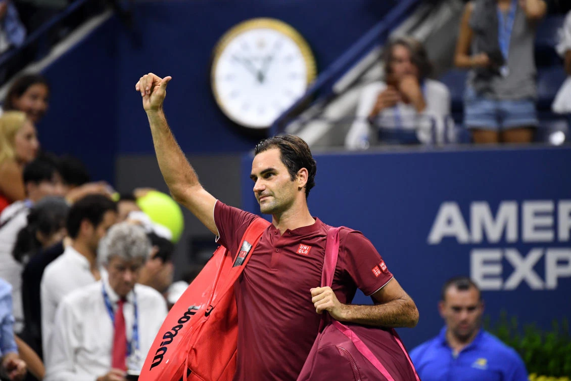 Roger Federer of Switzerland walks off the court after his loss to John Millman of Australia celebrates in a round of 16 match on day eight of the US Open.
(Danielle Parhizkaran-USA TODAY SPORTS)