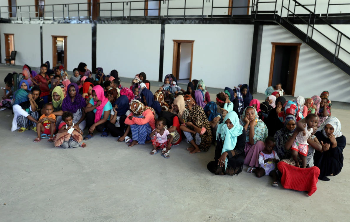 Migrants are seen in a shelter after they were relocated from government-run detention centers, after getting trapped by clashes between rival groups in Tripoli, Libya August 30, 2018. (Reuters)