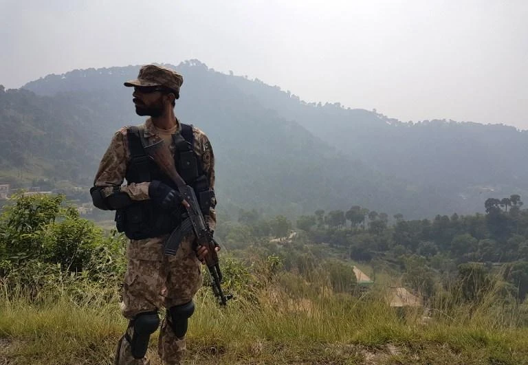 A Pakistani soldier patrols a village in district Bhimber near the Line of Control in Pakistan-administered Kashmir on October 1, 2016. (AFP)