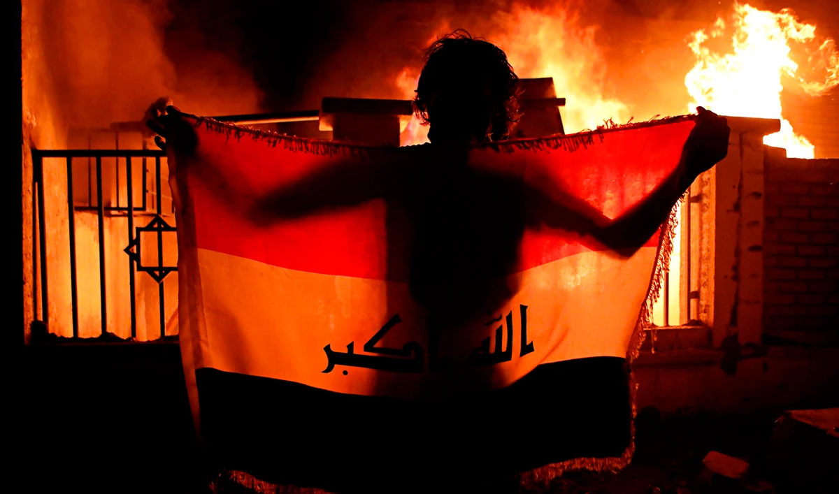 Protesters gathered near security forces guarding the local government building in Basra. (AP)