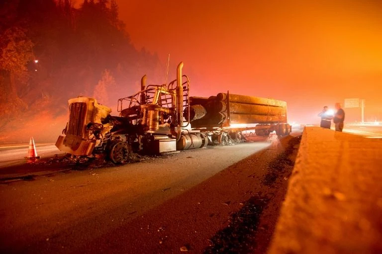 About 17 big-rigs were abandoned and at least four caught fire, officers from the California Highway Patrol said. (AFP)