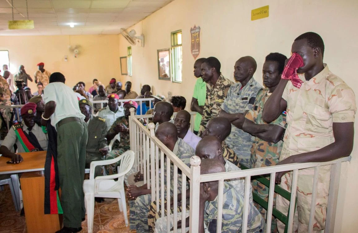 South Sudanese soldiers wait for their verdict at the military court in Juba, South Sudan, on September 6, 2018. (AFP)