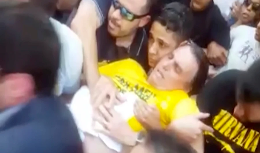Videos on social media showed being stabbed with a knife to the lower part of his stomach while campaigning in Juiz de Fora. (AP)