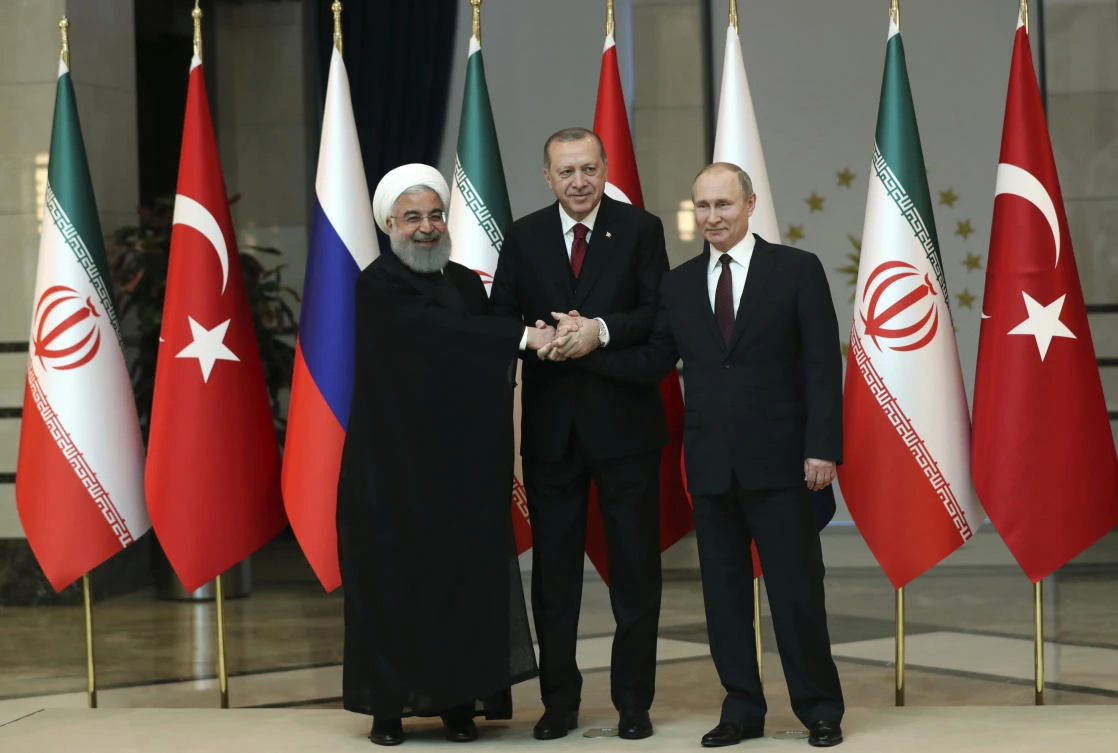 The summit between Iranian President Hassan Rouhani, left, Russian President Vladimir Putin, right, and Turkish President Recep Tayyip Erdogan may determine whether diplomacy halts any military action. (AP)
