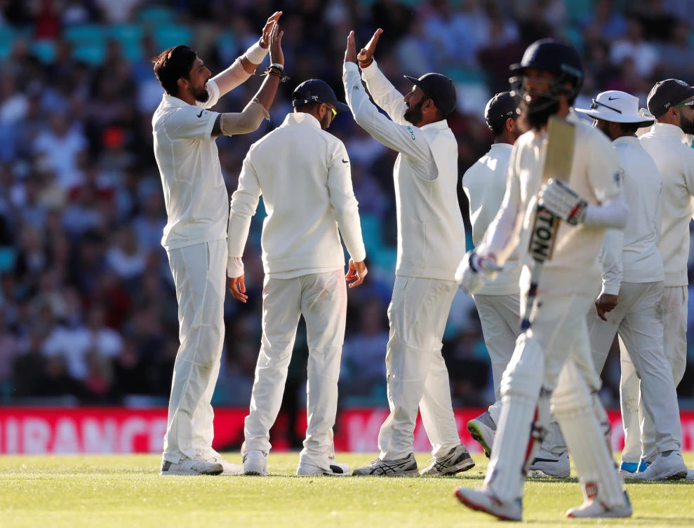 India's Ishant Sharma (left) celebrates the wicket of England's Moeen Ali. (Action Images via Reuters)
