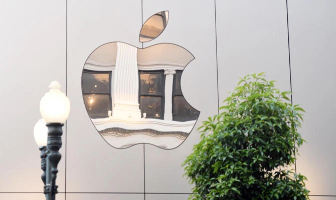 In this file photo taken on September 22, 2017 an Apple logo is seen on the outside of an Apple store in San Francisco, California. (AFP)