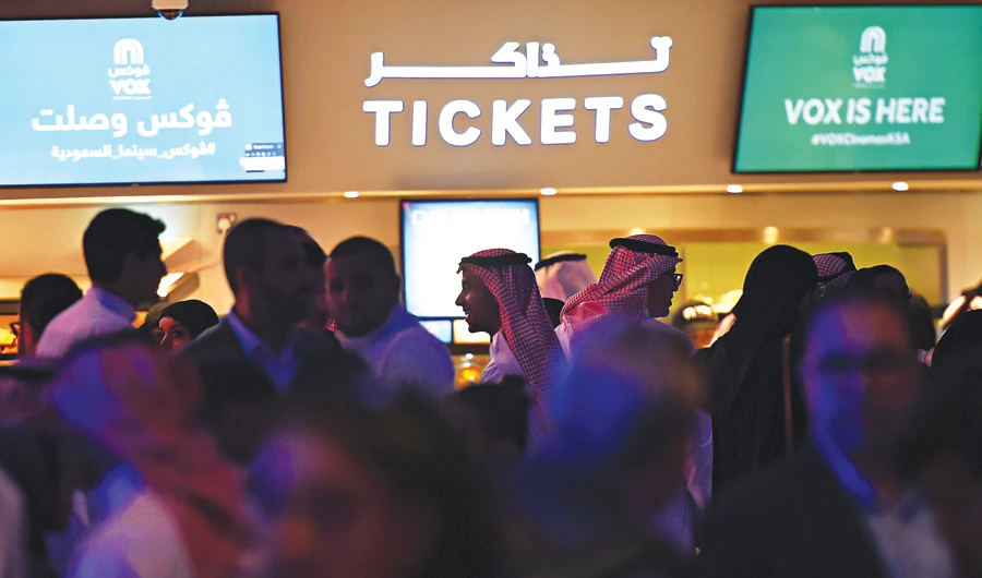 Film fans celebrate the end of Saudi Arabia’s 35-year ban on cinemas. (AFP)