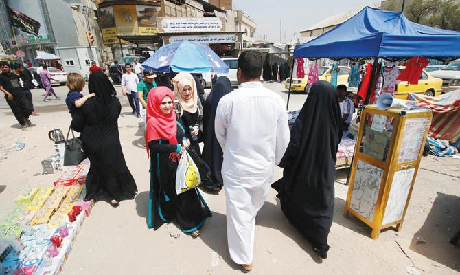 Iraqis in the market on Sunday after a week of violent protests in Basra. (Reuters)