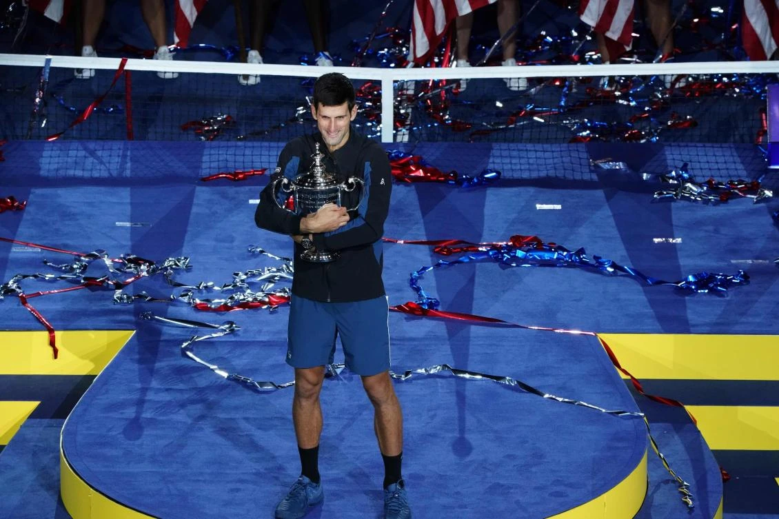 Novak Djokovic celebrates his victory over Juan Martin del Potro which saw him take his Grand Slam tally to 14. (AFP)